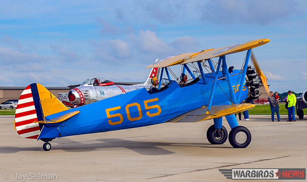 Turkey Wrestling - Flying the TBM Avenger 15 Many types of warbirds flew in for the event. Pictured are a Boeing Stearman, a North American F-86 Sabre, and the nose of a MiG-17 (far right). (Photo by Jay Selman)