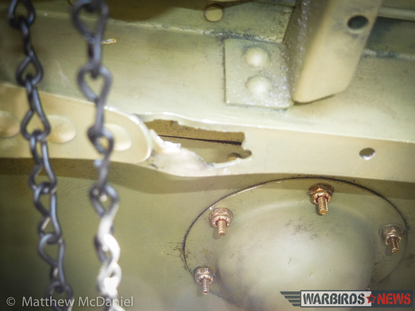 Turkey Wrestling - Flying the TBM Avenger 17 A bullet hole from 1945 in a fuselage stringer near the pilot's right hip area is eerie evidence of Bu. #85828's combat history. (Photo by Matthew McDaniel)