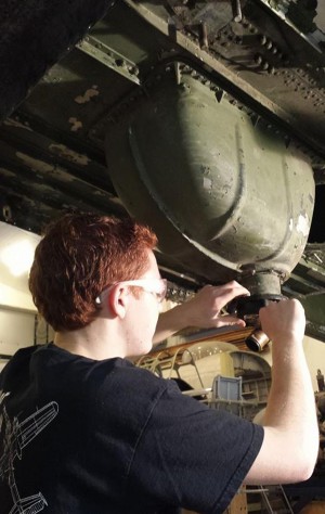 Sandbar Mitchell Project Update 12 We unbolted and removed the left nacelle from the center section in January. We also removed all the components from the lower center section wing panel including flap & landing gear castings, hydraulic actuators, plus both hydraulic and fuel lines. We then pulled both the front and rear auxiliary fuel bay panels and removed the fuel cells. In the picture above 15-year-old Logan is removing the oil tank sump assembly. (photo via Sandbar Mitchell Project)