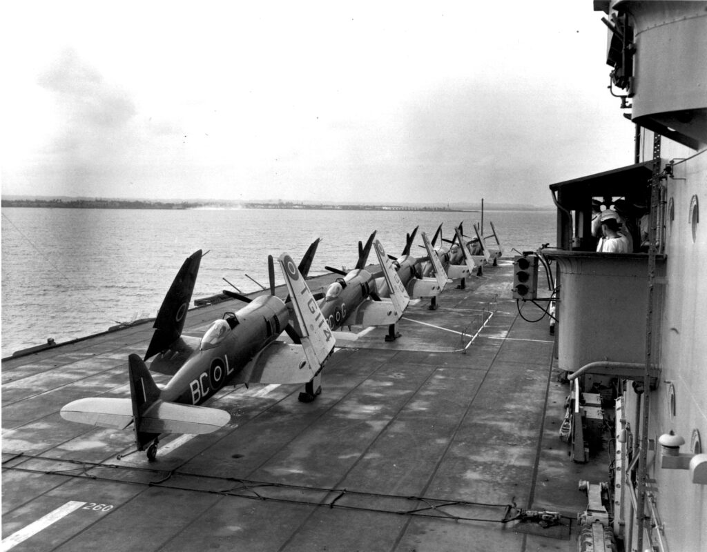 Sanders and the Argonaut 11 1 Sea Furies TG 114 VR 918 803 Sqn on HMS Magnificent Colon Panama March 15 1949 James WardDNDNatinal Archives of CanadaPA 168870