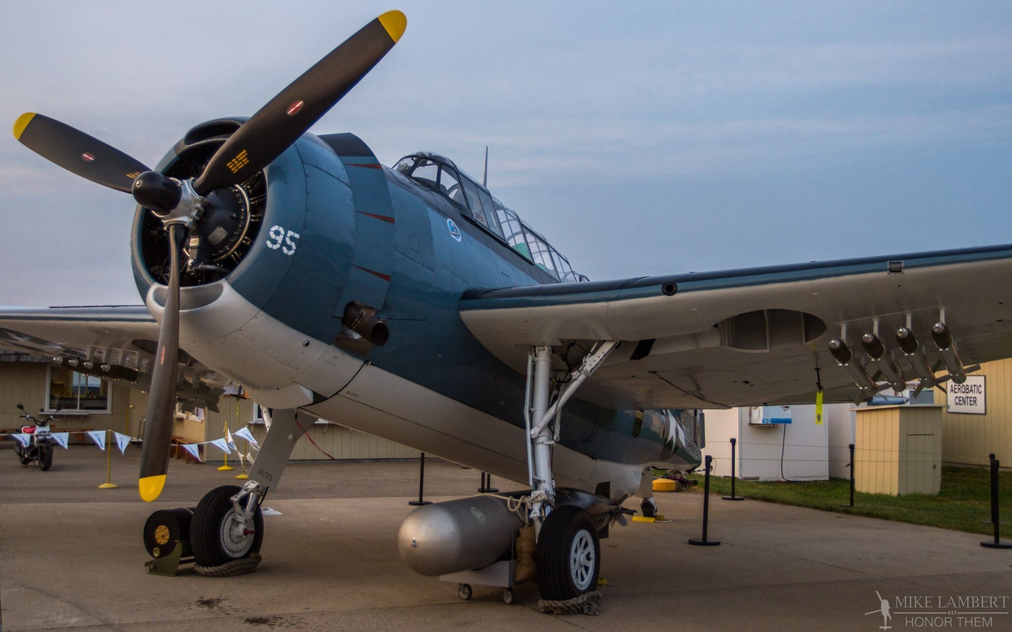 Wings and Warbirds Over Port Clinton 2015 11 Lake Erie Warbirds' TBM-3E in the evening light at EAA AirVenture 2014. (photo by Mike Lambert) Photograph by Mike Lambert