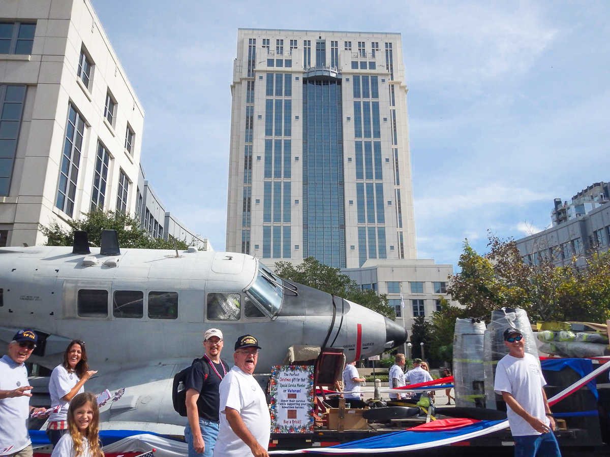 138th Aviation Company Memorial Kickstarter Campaign 11 The Ute aboard its low loader during the City of Orlando Veterans Day Parade with veterans and supporters of the 138th Aviation Company walking by its side. (photo via Andrew Rodriguez)