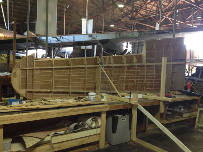 Australian Airspeed Oxford - Project Update 14 The Oxford's left wing in its jig. (photo via B-24 Liberator Memorial Fund)