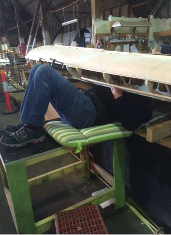 Australian Airspeed Oxford - Project Update 19 One of the volunteers working on the Oxford's left wing. (photo via B-24 Liberator Memorial Fund)