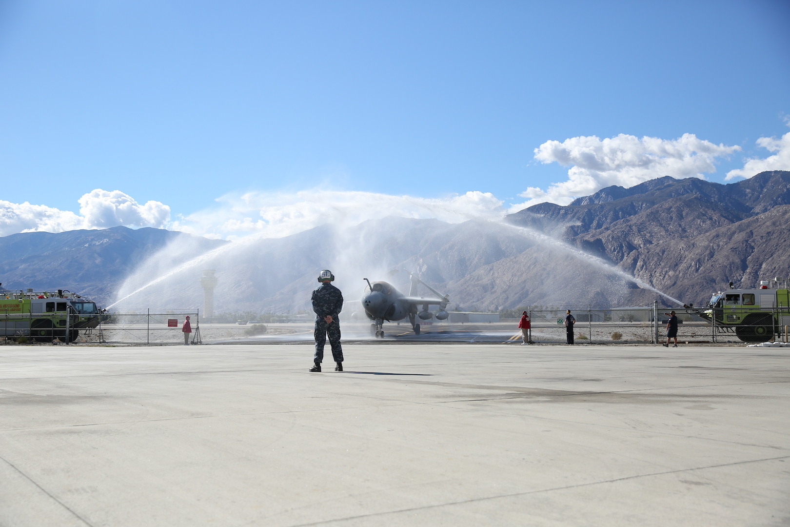Navy Retires ‘Prowler’ at Palm Springs Air Museum 11 The Navy EA-6B ‘Prowler’ fixed-wing aircraft taxis under a water arch, provided by the Palm Springs Fire Department, during the aircraft’s retirement ceremony at the Palm Springs Air Museum, Nov. 21, 2014. The water arch is a customary farewell for retiring aircraft. (Official Marine Corps Photo by Lance Cpl. Julio McGraw/Released)