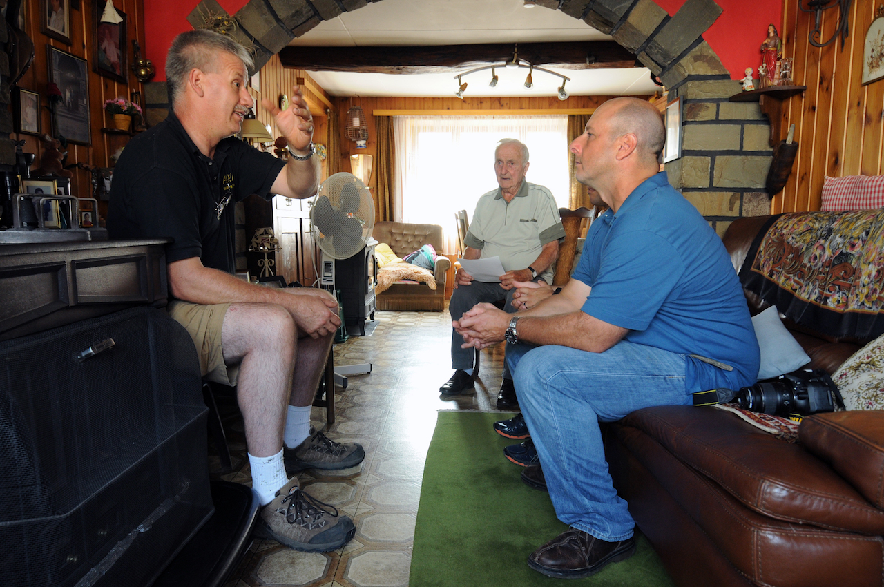 Coming Full Circle: A Chief Uncovers Great Uncle's WWII Crash Site, 70 Years Later 14 Gaston Mean, center, an Awyaille, Belgium, resident for more than 70 years, reads his letter depicting the events that took place Dec. 24, 1944, after a B-17 Flying Fortress crashed in his town following a dogfight in World War II, while Frédéric Winkin, left, a local World War II museum curator, translates for the group, Aug. 12, 2015. U.S. Air Force Chief Master Sgt. James McCloskey, right, can be seen listening to the story of how Mean helped pull his great-uncle from the wreckage. (U.S. Air National Guard photo by Senior Airman Shane S. Karp / Released)
