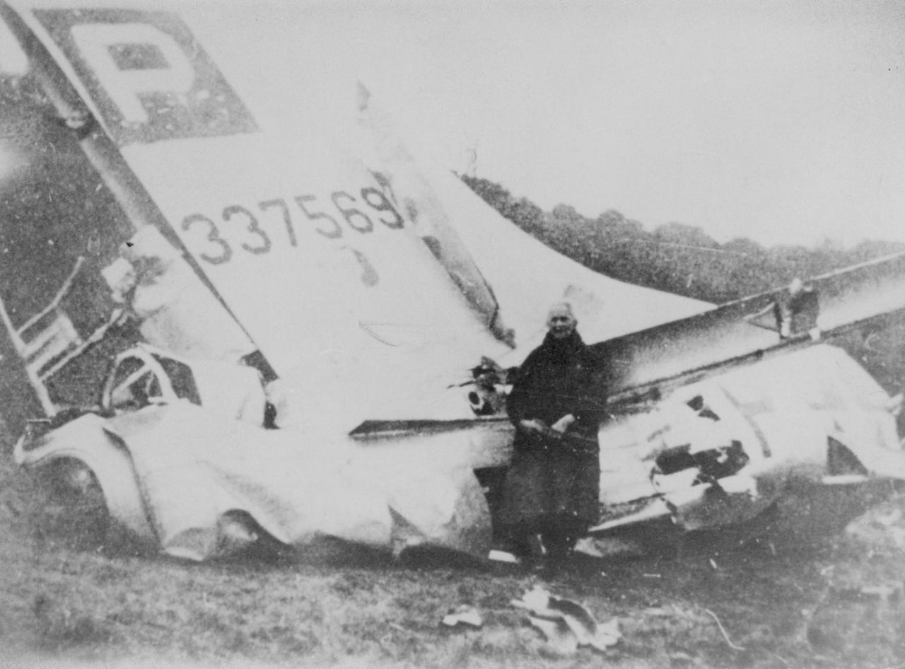Coming Full Circle: A Chief Uncovers Great Uncle's WWII Crash Site, 70 Years Later 11 An unknown man poses in front of a downed B-17 Flying Fortress, tail number 4337569, following a dogfight which occurred, Dec. 24, 1944. The aircraft's crew included 1st Lt. Vernal Cuno Becker, the tail gunner on the mission, and great-uncle of current U.S. Air Force Chief Master Sgt. James McCloskey. (Courtesy photo)
