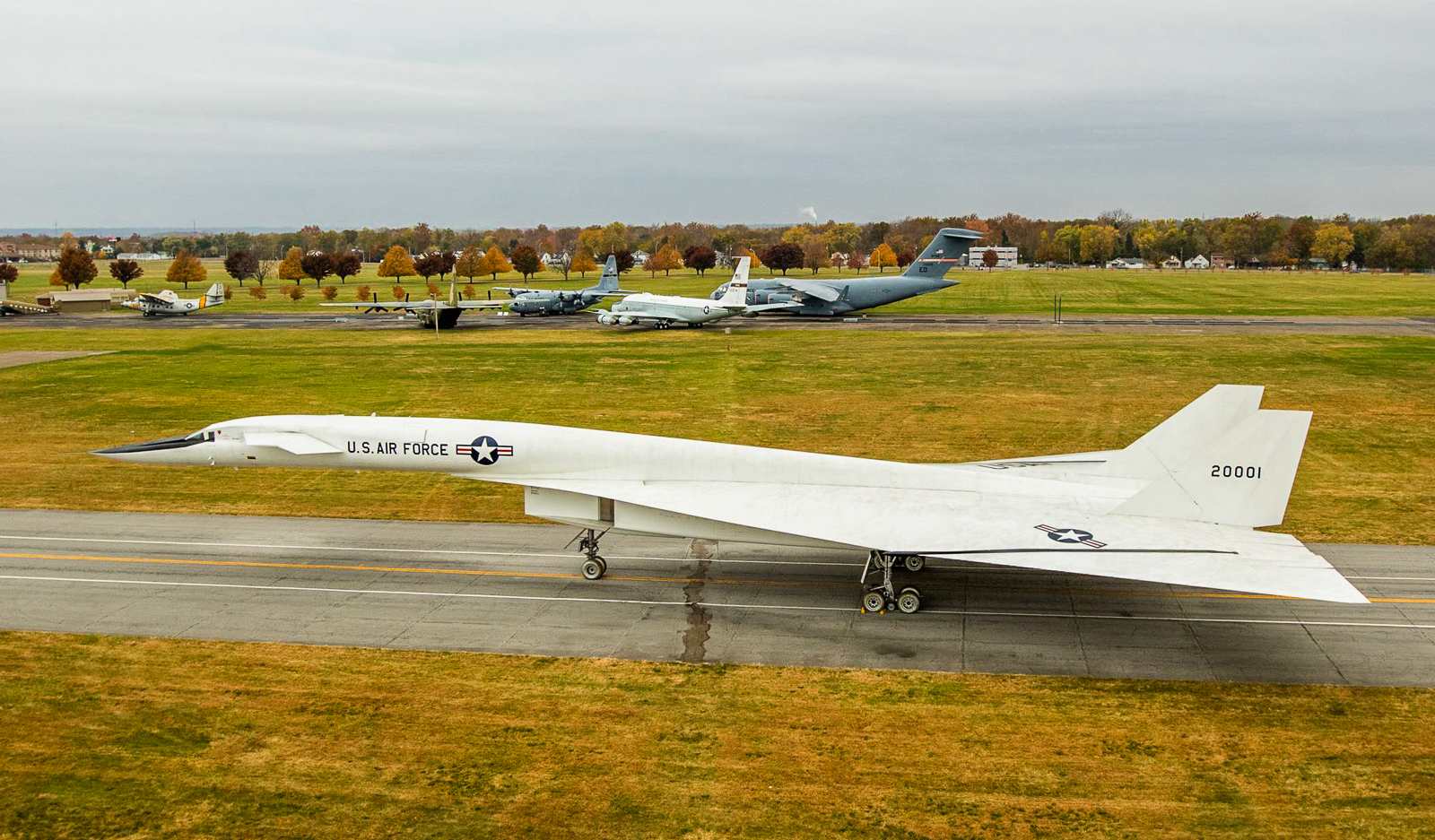XB-70 Valkyrie On the Move in Dayton 17 Another shot of the Valkyrie with a few of the remaining museum aircraft not currently under cover shown in the background. The new building will hopefully allow space for these aircraft in the now-vacated hangars where the XB-70 and others had recently occupied. (NMUSAF photo by Will Haas)