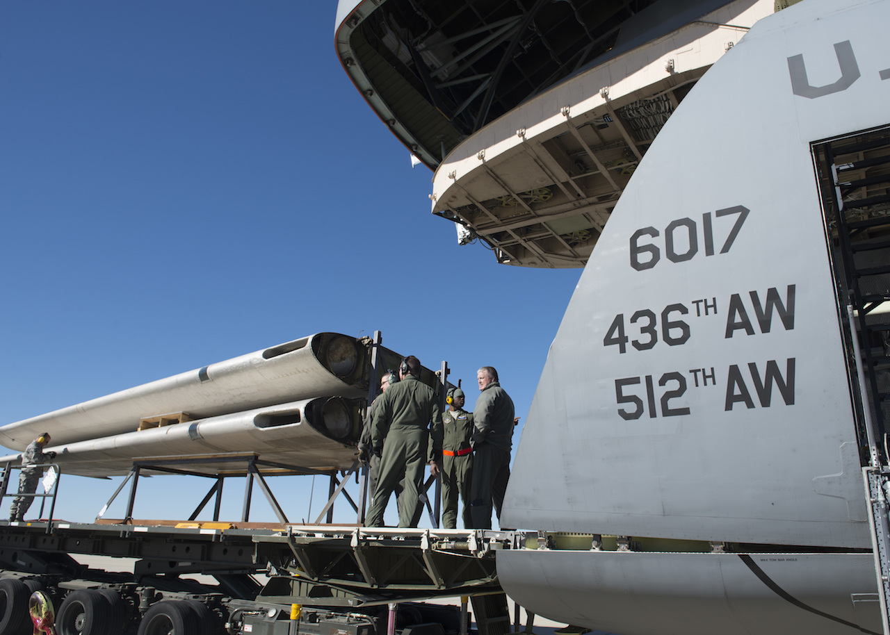 Air Mobility Command Museum Rescues C-119 13 Loadmasters from the 709th Airlift Squadron prepare to load the wings of the Fairchild C-119B Flying Boxcar #48-0352 “Am Can Co Special” into a C-5M Super Galaxy Dec. 19, 2016, at Edwards Air Force Base, Calif. The wings were the only portions of the C-119 to be loaded through the C-5M’s forward ramp. (U.S. Air Force photo by Senior Airman Zachary Cacicia)