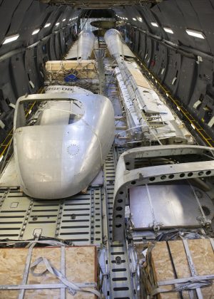 Air Mobility Command Museum Rescues C-119 14 Portions of the Fairchild C-119B Flying Boxcar #48-0352 “Am Can Co Special” sit inside a C-5M Super Galaxy’s cargo bay during a mission to bring it to the Air Mobility Command Museum Dec. 19, 2016, at Edwards Air Force Base, Calif. These aircraft portions weighed around 23,000 pounds. (U.S. Air Force photo by Senior Airman Zachary Cacicia)
