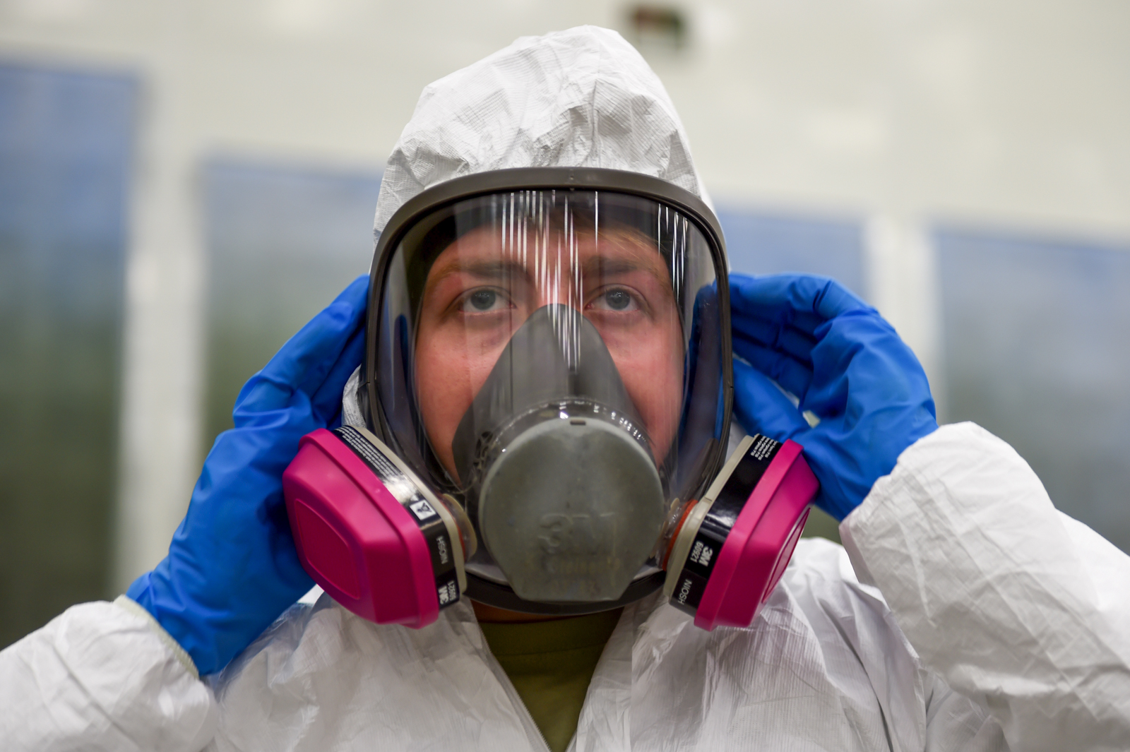 P-38G Lightning Under Refurbishment in Alaska 11 Air Force Senior Airman Kurtis Steinecke dons a Tyvek suit and full-face respirator before painting the P-38G Lightning inside Hangar 21 at Joint Base Elmendorf-Richardson, Alaska, July 17, 2017. Airmen are required to wear personal protective equipment when working on the P-38G Lightning. Steinecke is assigned to the 3rd Maintenance Squadron as an aircraft structural maintenance journeyman. (U.S. Air Force photo by Staff Sgt. Sheila deVera)