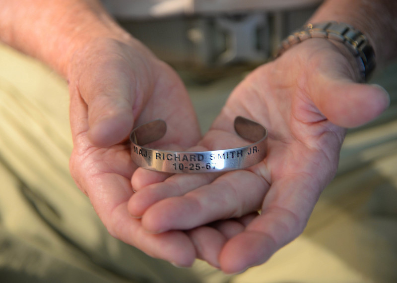 POW Recalls Mission That Led to Capture 50 Years Ago 15 Retired Lt. Col. Richard “Gene” Smith, former 50th Flying Training Squadron Commander, holds a prisoner of war bracelet Oct. 17, 2017, in his home in West Point, Mississippi. The bracelet was one of hundreds he had returned to him after he was repatriated. The date Smith was shot down, Oct. 25, 1967, is inscribed on the bracelet, along with his rank and name. The bracelets help keep the memory of POWs and those missing in action. (U.S Air Force photo by Airman 1st Class Beaux Hebert)
