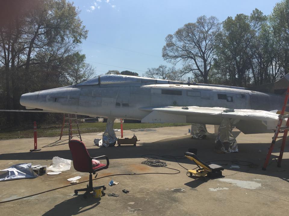 Museum of Aviation F-100 Super Sabre Goes on Display 18 Painting begins, light colors first. (photo by Aaron Robinson)