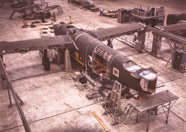 Help the Yankee Air Museum Save the Willow Run Bomber Plant! 14 A mating operation on a transport plane just before it comes to the pre-assembly line at the Consolidated Aircraft Corporation plant, Fort Worth, Texas. (Howard R. Hollem photo)