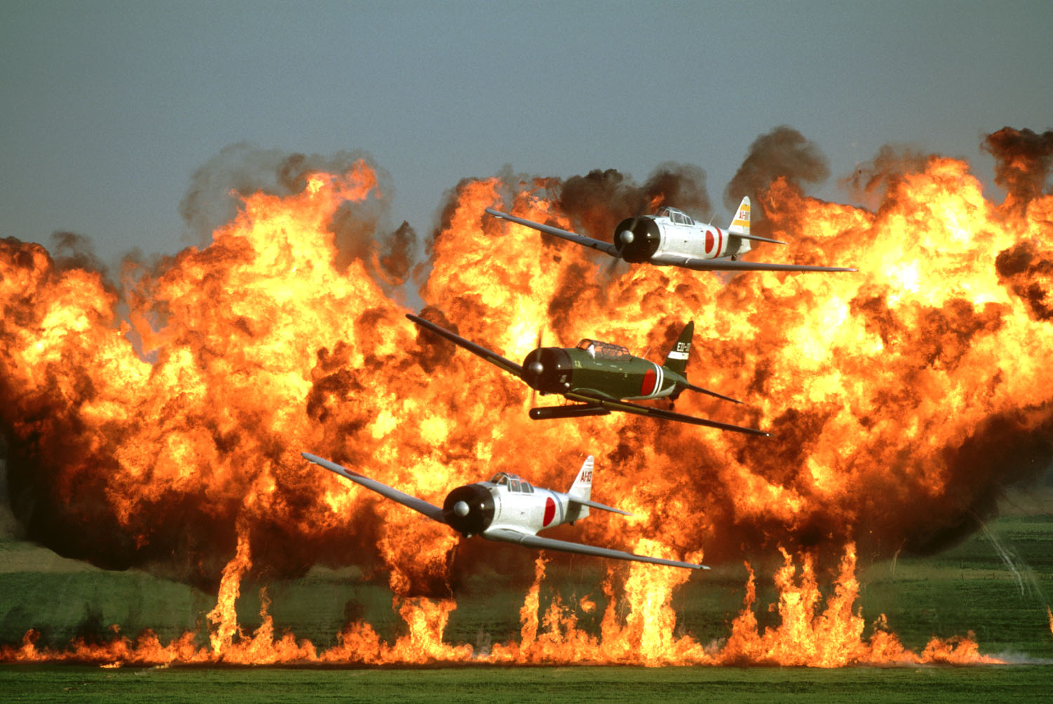 Final Lineup Announced for 2017 Wings Over Houston Airshow 18 Aircraft from the CAF's famous Tora! Tora! Tora! display routine fly past the crowd as pyrotechnics fill the air to their rear! (photo CAF Tora! Tora! Tora! team)