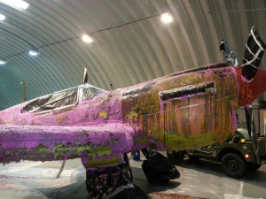 Hangar 11s Curtiss P-40 Kittyhawk Gets Stripped for a New Paint Scheme 10 Dissolving away the years, Hangar 11's Curtiss P-40 Kittyhawk is being stripped to bare metal in preparation for an new color scheme.