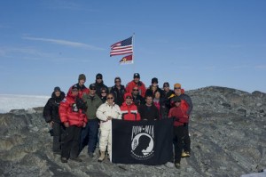 WWII Rescue Plane Located in Greenland Glacier 11 An expedition team of U.S. Coast Guard service members and North South Polar, Inc. scientists and explorers display the POW/MIA flag in honor of the expedition to find the crash site of a WWII Coast Guard Grumman Duck. (Photo credit: USCG)