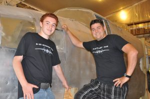 Sandbar Mitchell Recovery Crew Alaska-Bound 11 Helper Logan and Patrick Mihalek pose with the nose. Nice shirts, by the way.