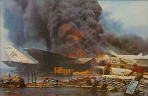 Some of the Most Important Planes on US Navy Carriers Never Fly 12 Fire aboard the US Navy aircraft carrier USS Forrestal (CVA-59) on July 29, 1967. Two North American RA-5C Vigilantes burn on the starboard side aft of the island, while crewmen remove AGM-45 Shrike missiles in the foreground. (Image Credit: US Navy)