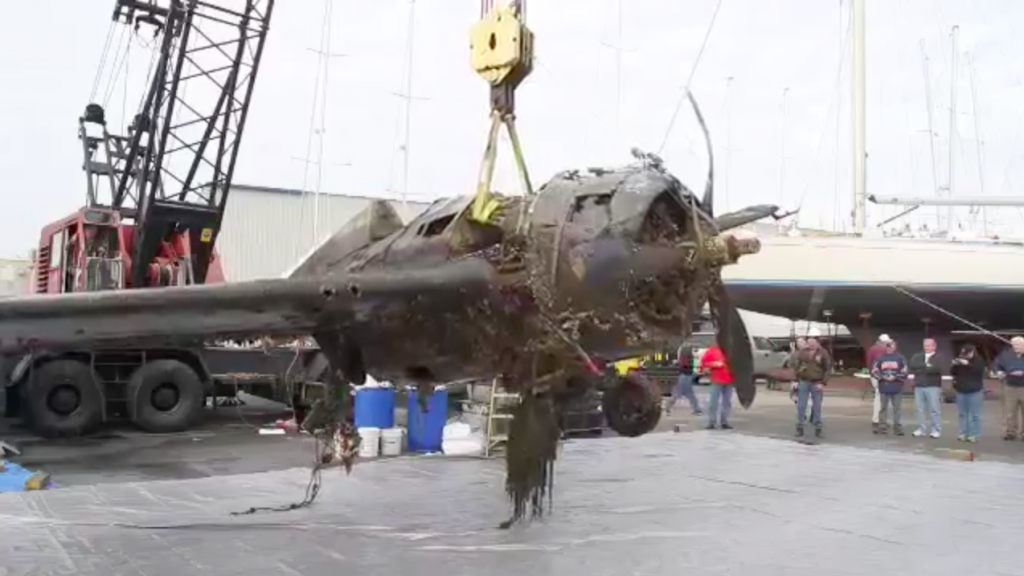 Air Zoo to Restore Lake Michigan-Retrieved FM-2 Wildcat 10 Wildcat FM-2 57039, Lifted from the water, heading to Air Zoo for a full restoration
