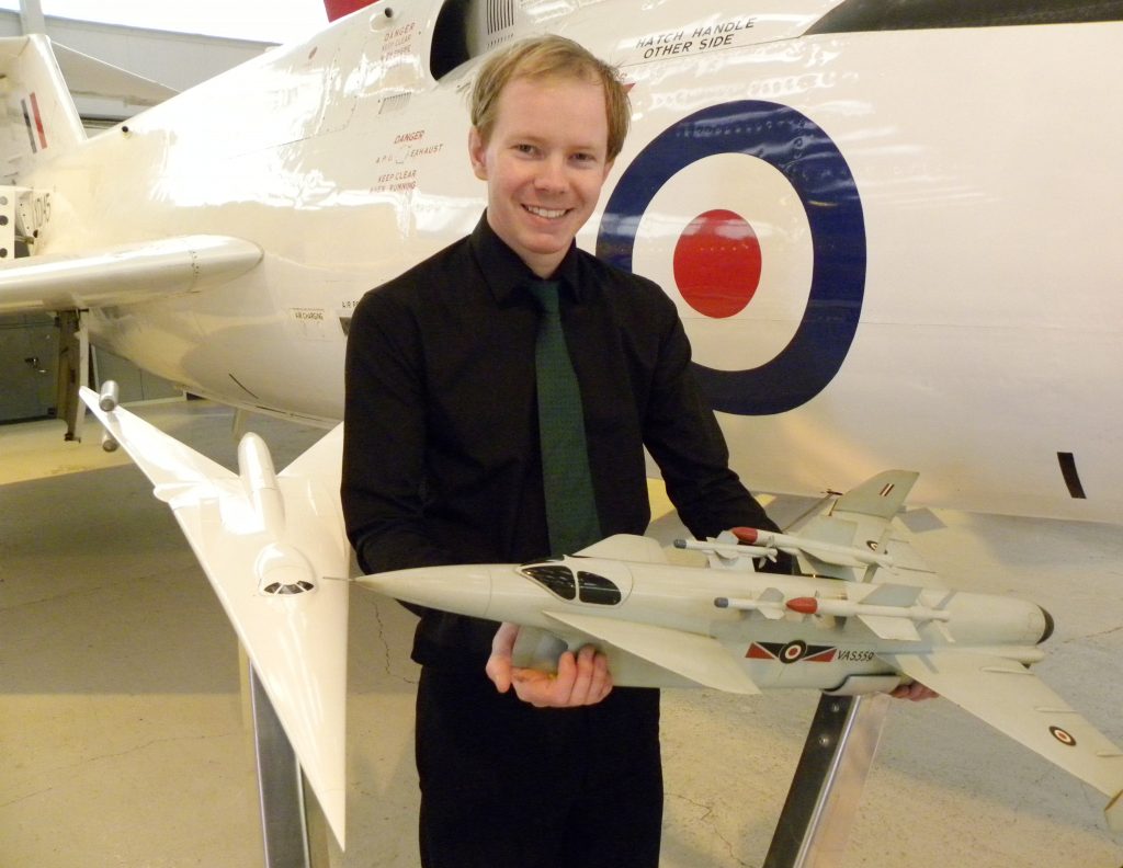 RAF Museum Cosford Exhibits Models of Cancelled Concept Aircraft 10 RAFM Curator Nick Sturgess with two concept models, holding the Vickers Type 559. (Image Credit: RAF Museum)