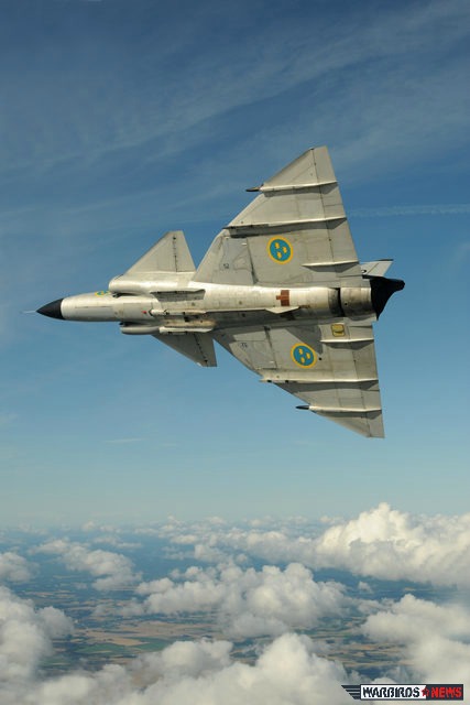 The Swedish Air Force Historic Flight From Within the Cockpit 10 SwAFHF-restored Saab 37 Viggen soaring above the clouds shows its unique planform. (Image Credit: Luigino Caliaro)