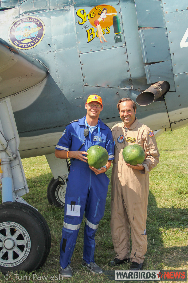 The Greatest Show on Turf 2017 - Geneseo Air Show Report 28 Charlie Lynch (r) in front of his TBM with Doug Marotte, showing off a pair of watermelons which would be used in the watermelon 'bomb' drop flown by Lynch in his TBM. (Photo by Tom Pawlesh)