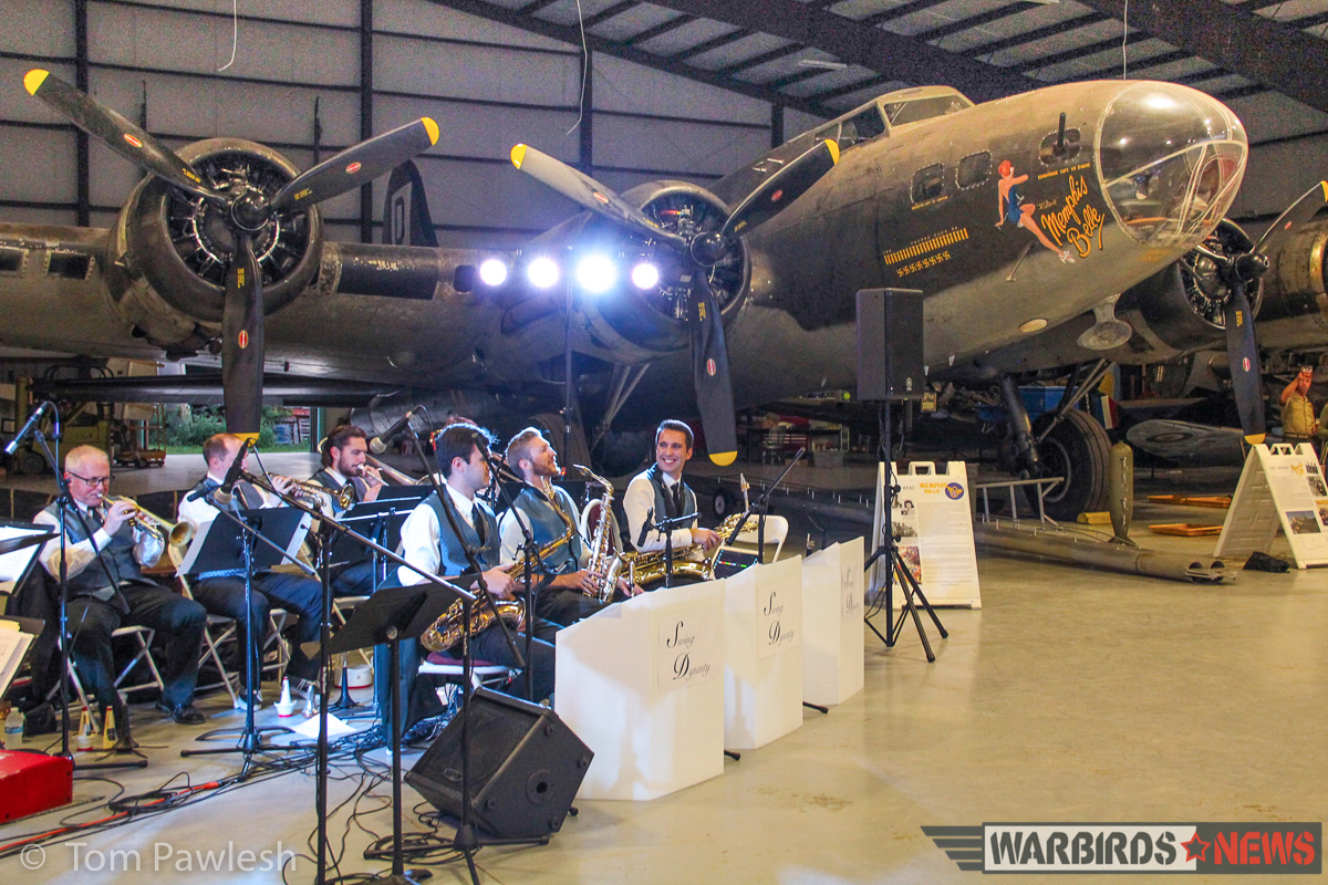 The Greatest Show on Turf 2017 - Geneseo Air Show Report 21 The band plays at the hangar dance with the B-17G 'The Movie Memphis Belle' in the background. (Photo by Tom Pawlesh)