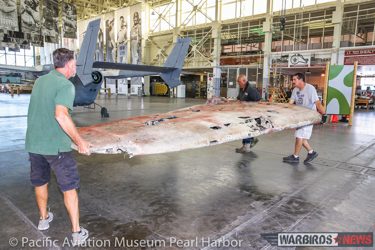 Nakajima B5N2 'Kate' Unveiled at Pacific Aviation Museum Pearl Harbor 17 Lifting the starboard outer wing panel. (photo via Pacific Aviation Museum Pearl Harbor)