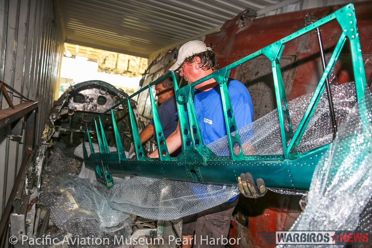 Nakajima B5N2 'Kate' Unveiled at Pacific Aviation Museum Pearl Harbor 15 Unloading the Kate from the shipping container. As can be seen from the shiny new control surface being handled, some of the rebuild has already taken place. (photo via Pacific Aviation Museum Pearl Harbor)