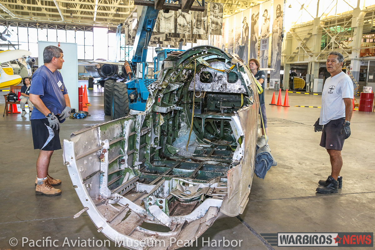 Nakajima B5N2 'Kate' Unveiled at Pacific Aviation Museum Pearl Harbor 16 A closer look inside the fuselage/cockpit section looking from the rear as museum staff move the parts into position. (photo via Pacific Aviation Museum Pearl Harbor)