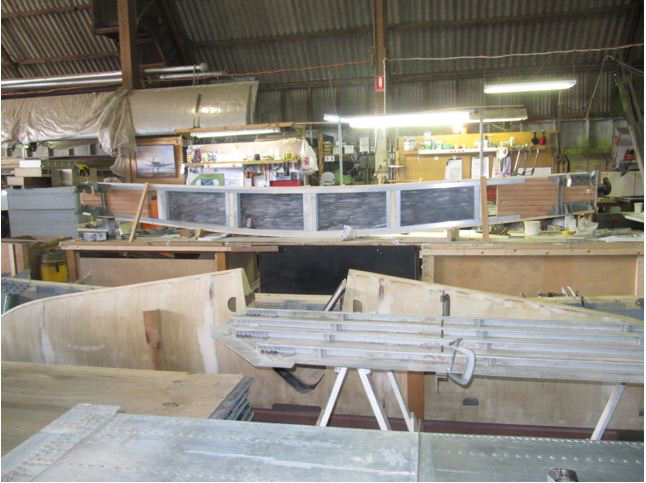 Australian Airspeed Oxford - Project Update 21 Several skin panels from the B-24 can be seen in the foreground, while the Oxford's horizontal stabilizer is on view just beyond. The Oxford's wing center section main spar is coming together in the background.