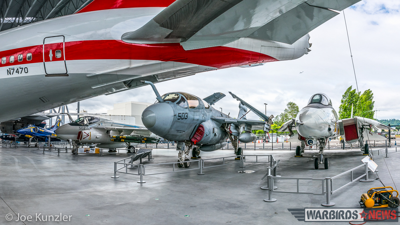 A Look Inside the Museum of Flight's New Aviation Pavilion 21 Four Cold War-era naval jets sit beneath the tail of the first 747. (photo by Joe Kunzler)