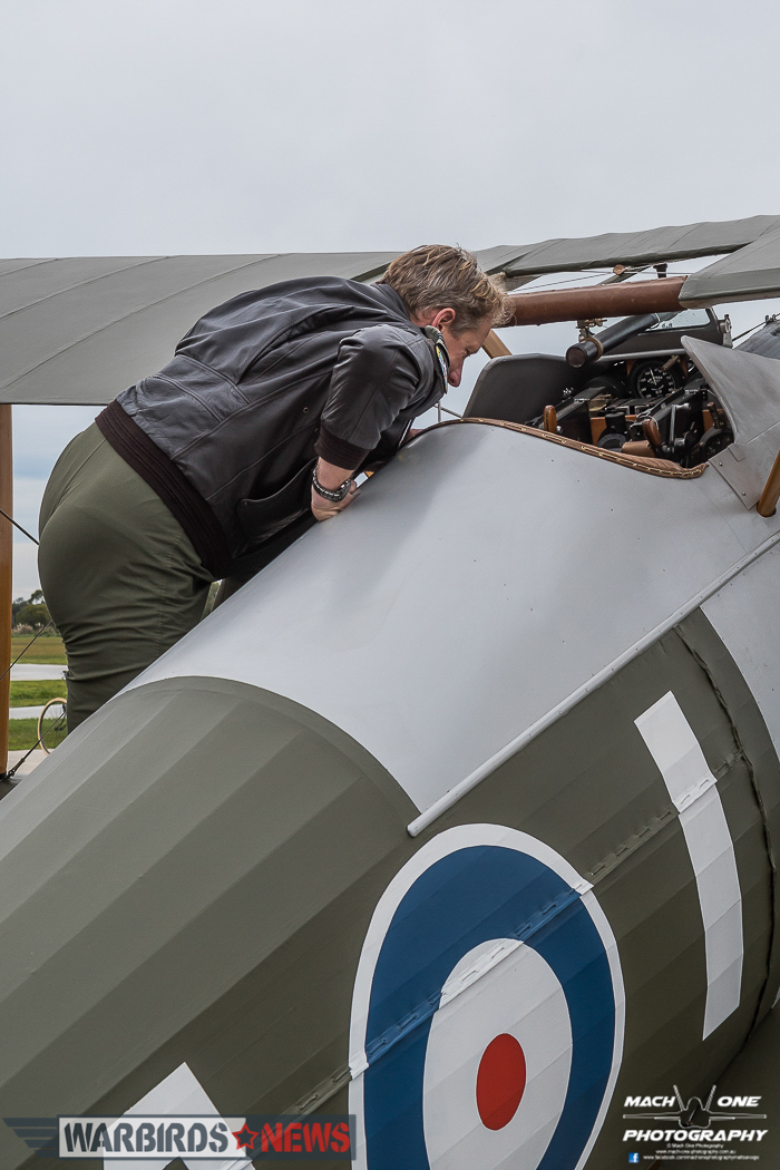 4 Squadron RAAF: Celebrating A Centenary - 1916 - 2016 17 Flt.Lt.Burrows inspecting the spartan cockpit of the Sopwith Snipe. (photo by Matt Savage)
