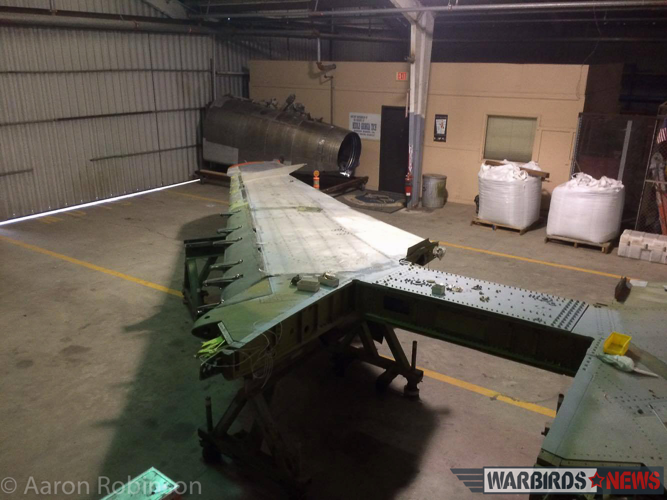 Combat Veteran F-100D Super Sabre Restoration 24 Preparing the wings for re-installation on the airframe. (photo by Aaron Robinson)
