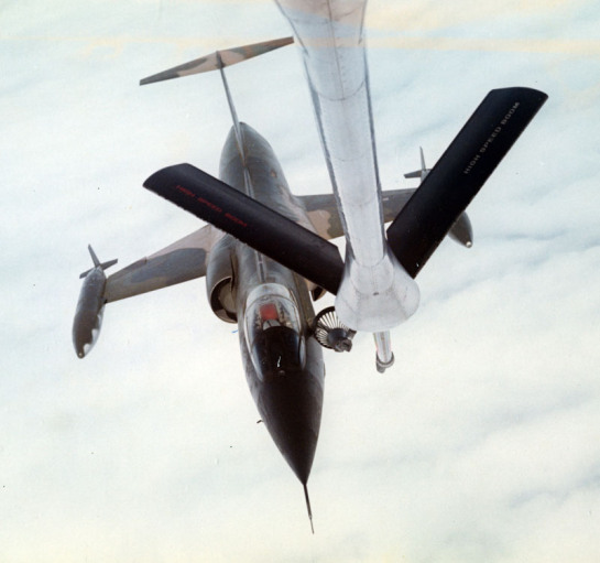 Above Rivalries: A Navy–Air Force Rescue That Defined Service 14 A F 104C refuels from a boom to drogue adapter BDA equipped KC 135 Stratotanker