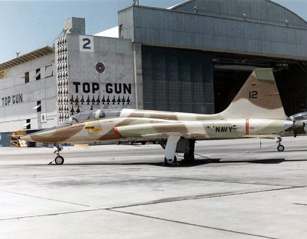 NASM Lecture: Top Gun Then and Now 10 A T 38A Talon assigned to the Navy Fighter Weapons School pictured in front of the TOPGUN hangar on board Naval Air Station NAS Miramar