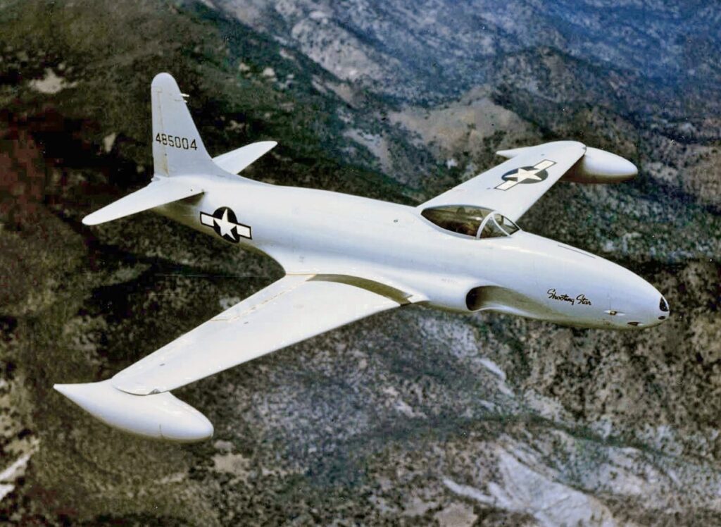 Gregory "WIRED" Colyer And His T-33 Ace Makers 11 A U.S. Air Force Lockheed P 80A 1 LO Shooting Star s n 44 85004 in flight. This aircraft was later upgraded to an F 80C 11 LO