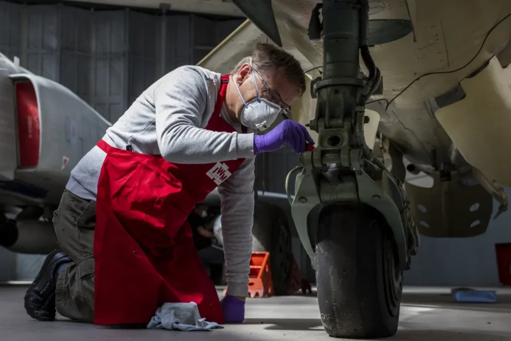 Transforming IWM Duxford: A New Era for Britain's Historic Airfield 14 A member of IWMs Conservation Team working on an aircraft IWM