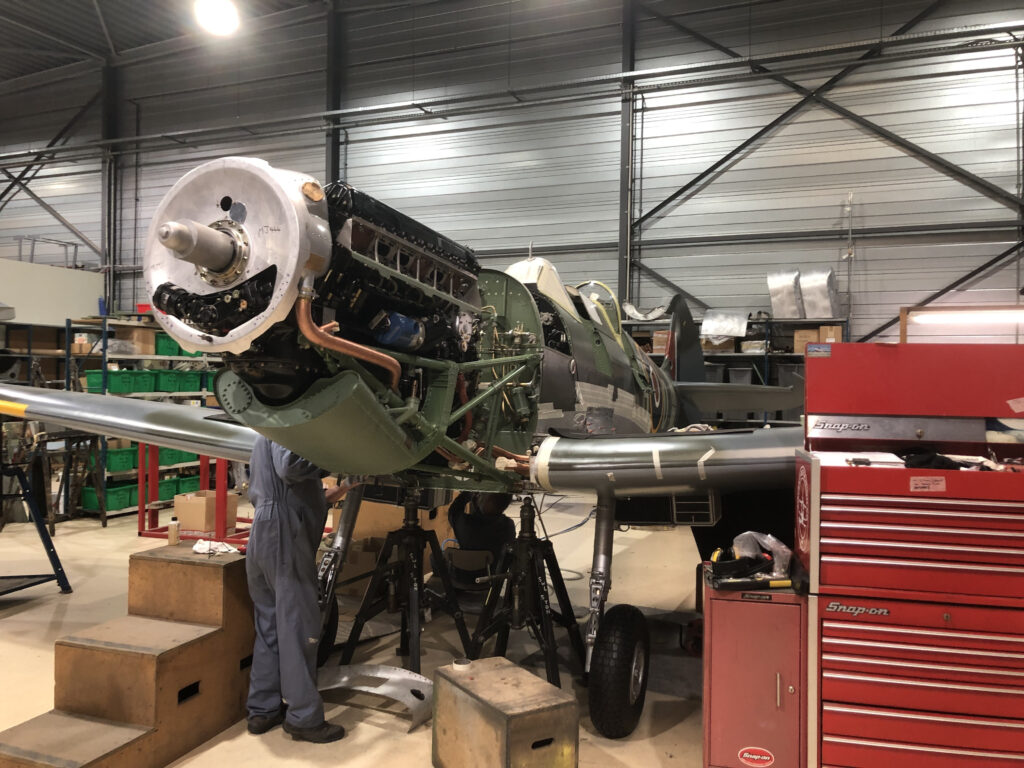 Aero Legends' Spitfire MJ444 Restoration - April Update 10 A quick visit to Duxford on 14th February and MJ444’s Merlin 500 engine is now fitted. This variant of the Merlin has a single stage supercharger, resulting in increased performance and reliability (Photo Peter Hall)