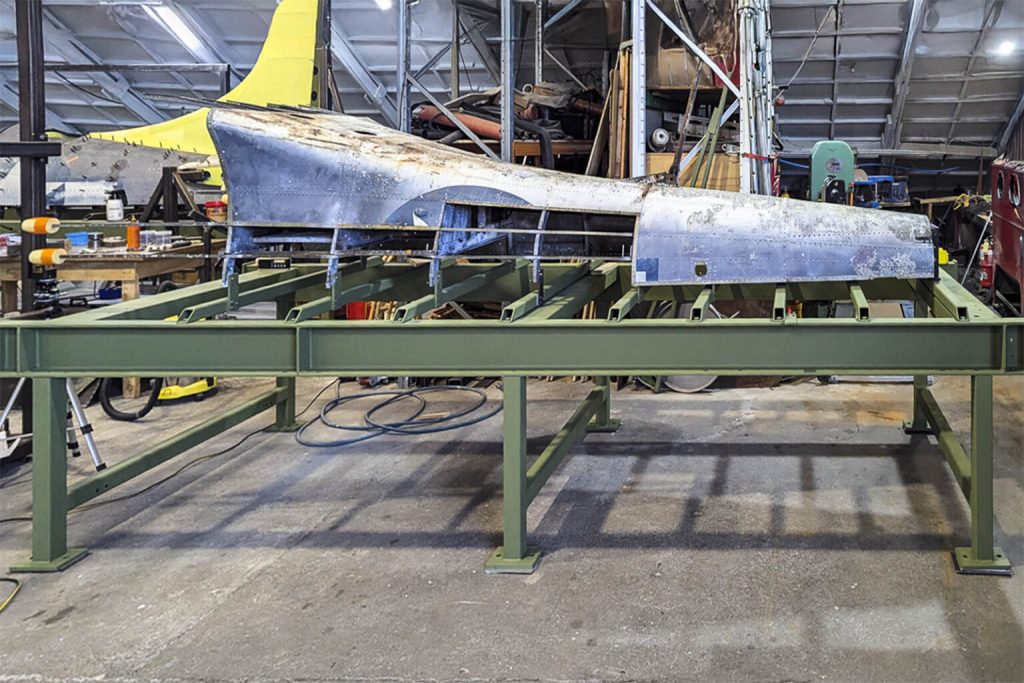 Military Aviation Museum SBD-5 Dauntless – Restoration Update 11 A side on view of the SBDs lower rear fuselage mounted to its restoration jig prior to major disassembly which began in recent weeks