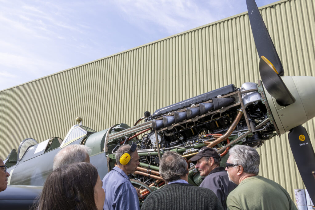 Spitfire MJ444 Roars! 11 ARCos Mo Overall talks the MJ Supporters through the finer points of the Merlin 500 Photo Michael Zakariudakis