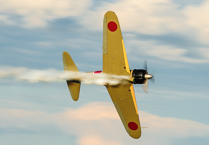 Texas Flying Legends - Oshkosh Here We Come!!! 14 TFLM's Zero after having been 'shot down' by their P-40. (photo by Jake Peterson)
