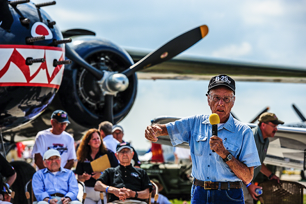 Texas Flying Legends - Oshkosh Here We Come!!! 18 A WWII B-25 veteran describes his wartime experiences during a Warbirds in Review session at AirVenture Oshkosh while standing in front of TFLM's Mitchell Betty's Dream. (photo by Jake Peterson)