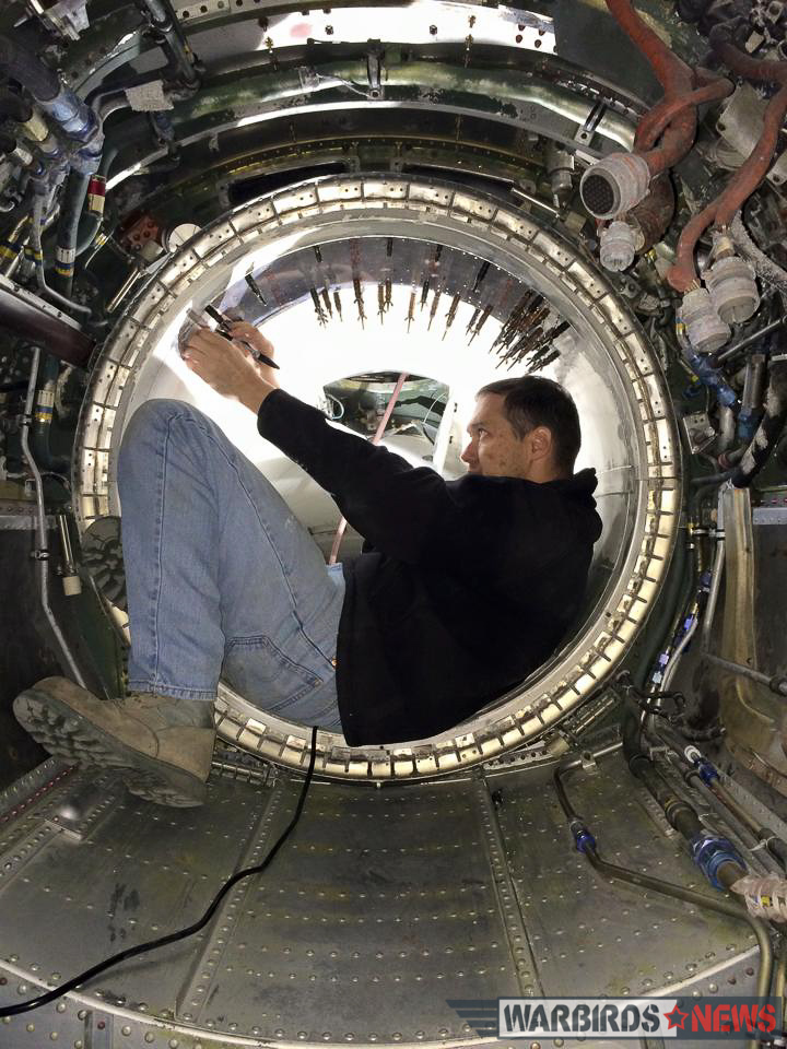 Combat Veteran F-100D Super Sabre Restoration 19 Aaron Robinson working inside the Hun's tailpipe. (photo via Aaron Robinson)