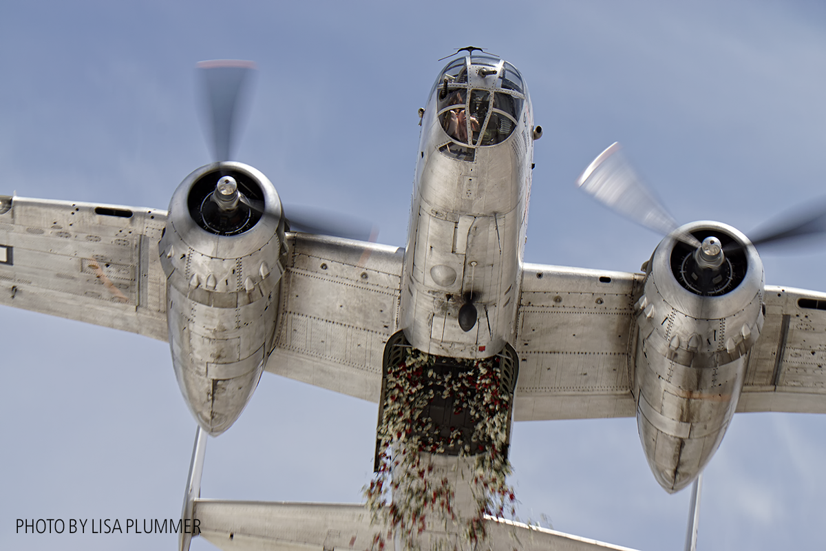 Palm Springs Air Museum Flying High in 2017 12 Aero Trader own B-25 piloted by Carl Scholl dropping 3000 carnations from the bomb bay. ( photo by Lisa Plummer)