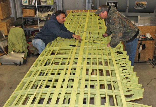 XP-82 Twin Mustang Restoration - February 2014 Update 11 Ayman and Randall working to get the holes drilled on the outer wings for skin installation. (photo via Tom Reilly)