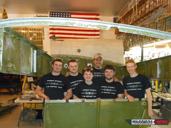 B-25 Sandbar Mitchell - April Restoration Update 10 Some of the Sandbar Mitchell volunteers with the freshly disassembled left hand inboard wing spar web. (photo via Sandbar Mitchell)