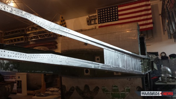 B-25 Sandbar Mitchell - April Restoration Update 11 The left hand spar in it's disassembled state, showing the inner webbing clecoed into place. The missing outer web will need remanufacturing due to corrosion issues. (photo via Sandbar Mitchell)