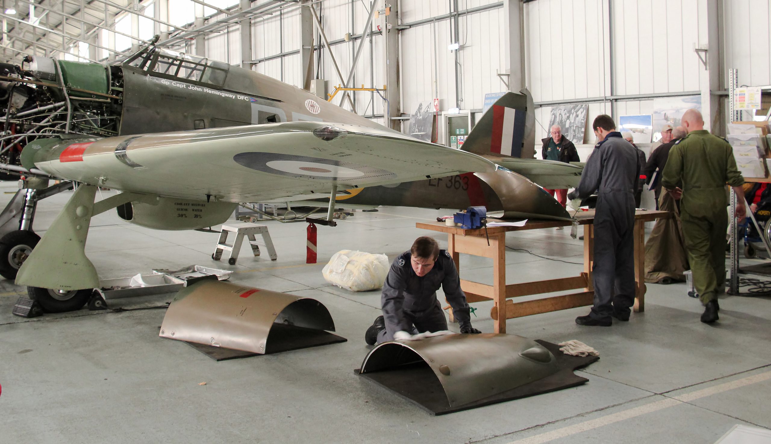 Royal Air Force Battle of Britain Memorial Flight Begins Winter Maintenance Cycle 11 BBMF technicians at work around Hurricane Mk II LF363 in October. Photo Clive Rowley scaled